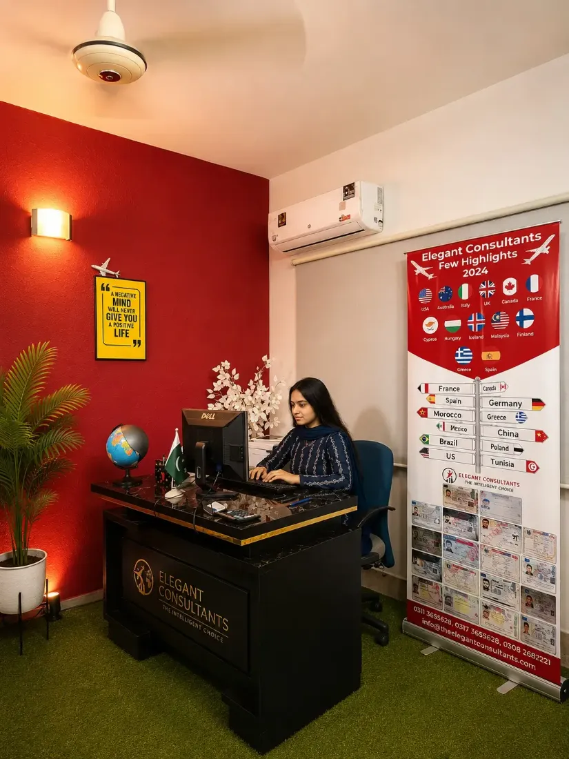 The Elegant Consultants Karachi office reception, with international flags and branded desk
